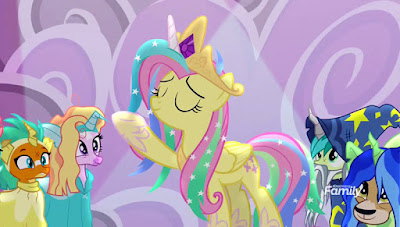 As the Student Six look on in their magic-users' costumes, Fluttershy, dressed as Princess Celestia, lifts a forehoof to command the Sun to rise