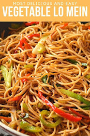 Authentic lo mein recipe is what you need to fix your dinner or lunch under 30 mins! Stir-fry vegetables, amazing sauce mix all tossed together with egg noodles make the best restaurant style dinner #savorybitesrecipes #lomein #vegetablelomeinrecipe #easyrecipe #dinnerideas #delicious #homemadenoodles a close look of vegetable lo mein with spring onion,carrots,celery and bell peppers