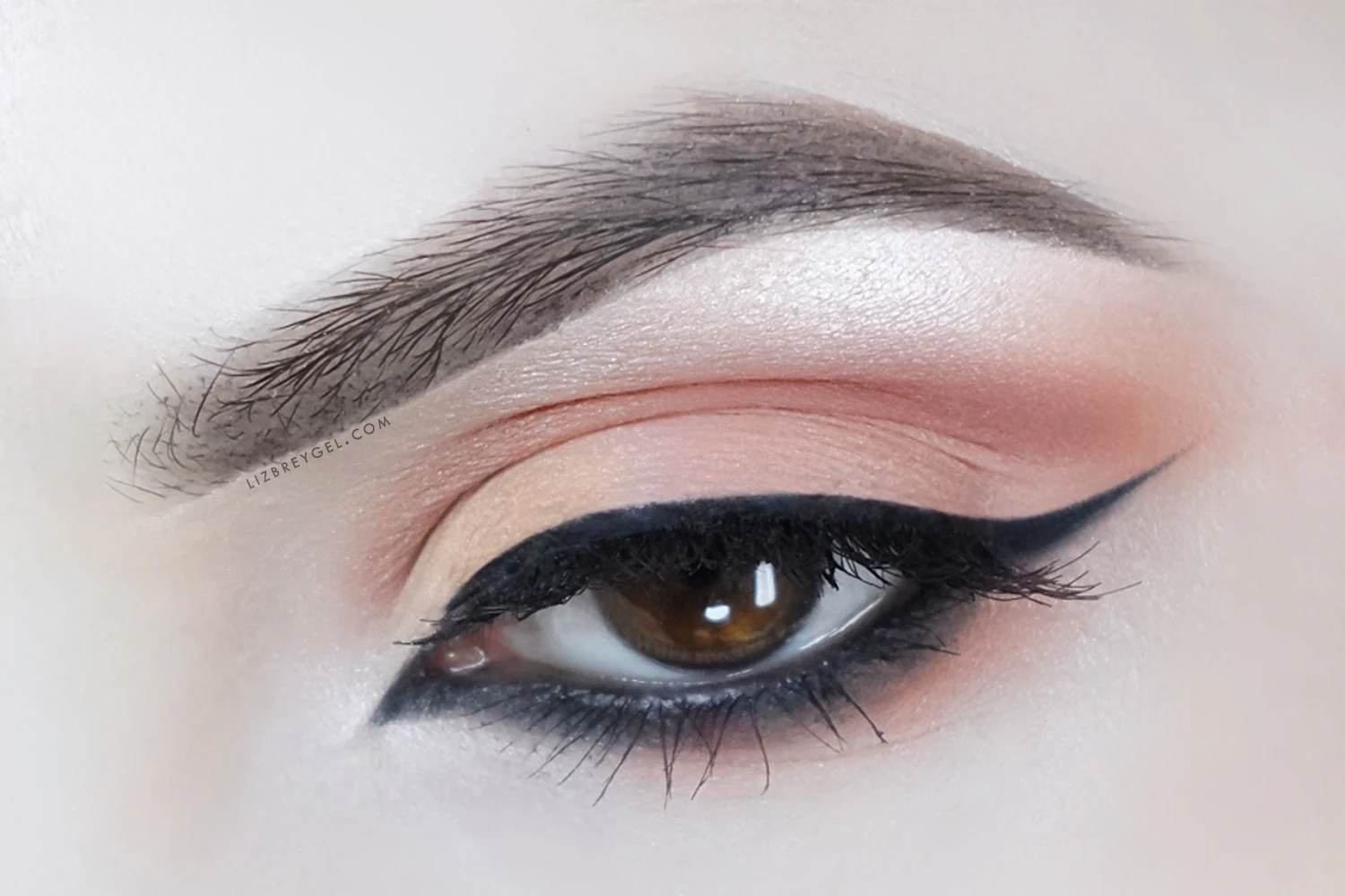 a close up picture of brown eye with a soft, everyday makeup look