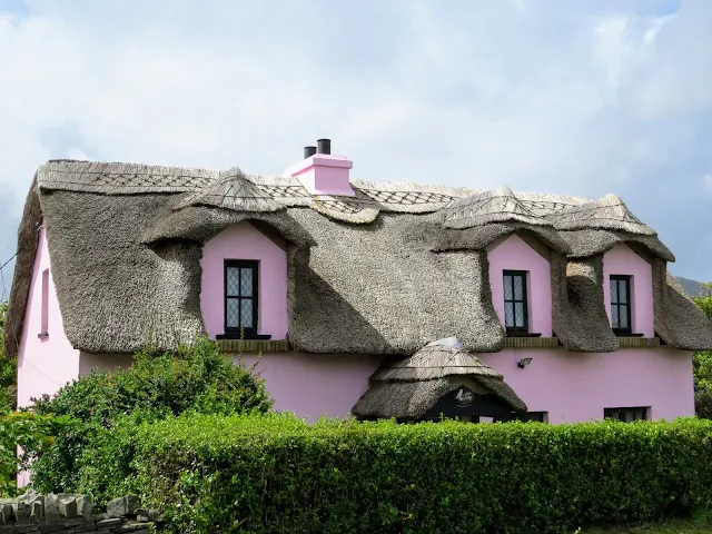 Pink thatched cottage on a Connemara Irish road trip