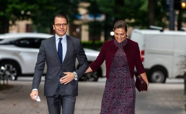 Princess Victoria wore a printed midi dress from By Malina. Rizzo Azelia suede pumps and Saturn earrings. By Malina Lysandra dress