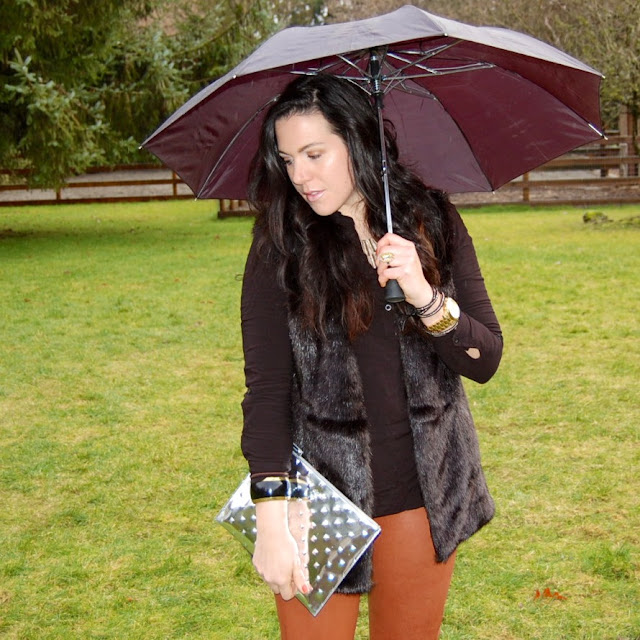 J brand leather leggings with a faux fur vest and Ela clutch