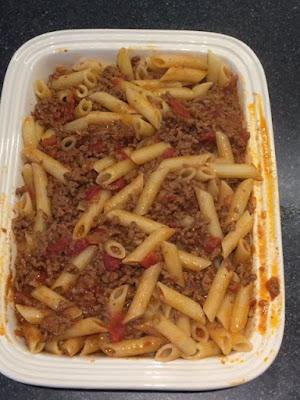 Bolognese sauce and pasta in casserole dish