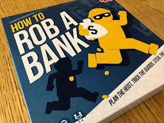 The box for How to Rob a Bank, showcasing the fun artwork.