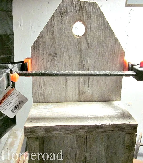 clamping the wood to hold it together to create a storage crate