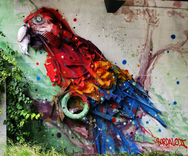 This vibrant Macaw is the last Street Art Installation By Bordalo II Somewhere in Portugal. 2