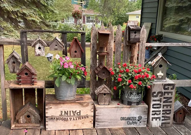 Photo of rustic birdhouses on the deck