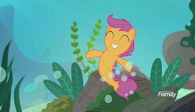 A very happy Scootaloo, as a seapony, with clumps of seaweed behind her