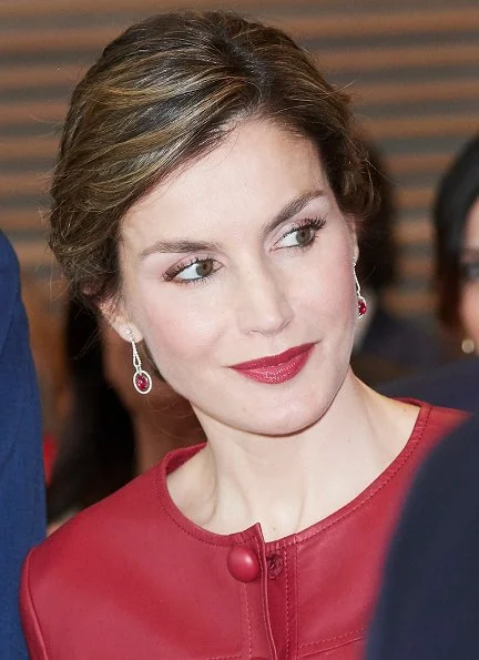 Queen Letizia wore CAROLINA HERRERA Peplum Jacket, LODI Pumps Shoes, carries UTERQUE Snakeskin Clutch