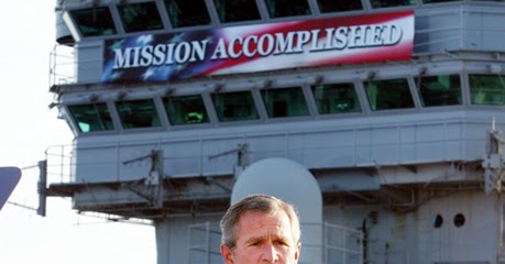 george-bush-meme-mission-accomplished-banner-lipstick-pig.jpg
