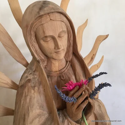 carved wood statue of Virgin Mary in abbey at Allegretto Vineyard Resort in Paso Robles, California