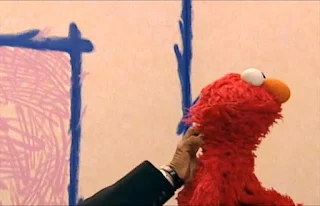 The hand scratches his back and says Elmo's furry. Sesame Street Elmo's World Hands Interview