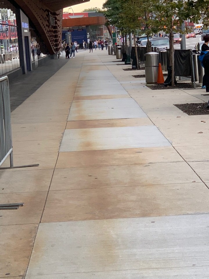 The rust recurs on the Barclays Center sidewalk