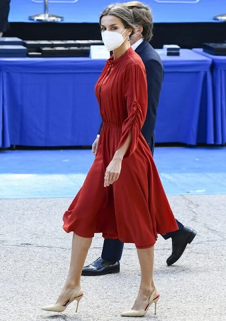Queen Letizia of Spain wore a red long sleeve flared midi dress by Salvatore Ferragamo