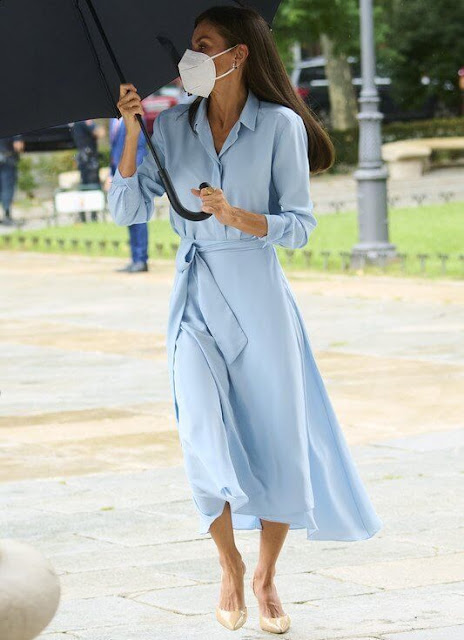 Queen Letizia wore a light blue belted shirt dress from 2019 collection of Pedro del Hierro. Carolina Herrera pumps