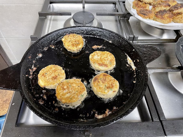 frying shami kebabs in a shallow pan with some oil