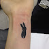 Little rabbit tattoo on hand