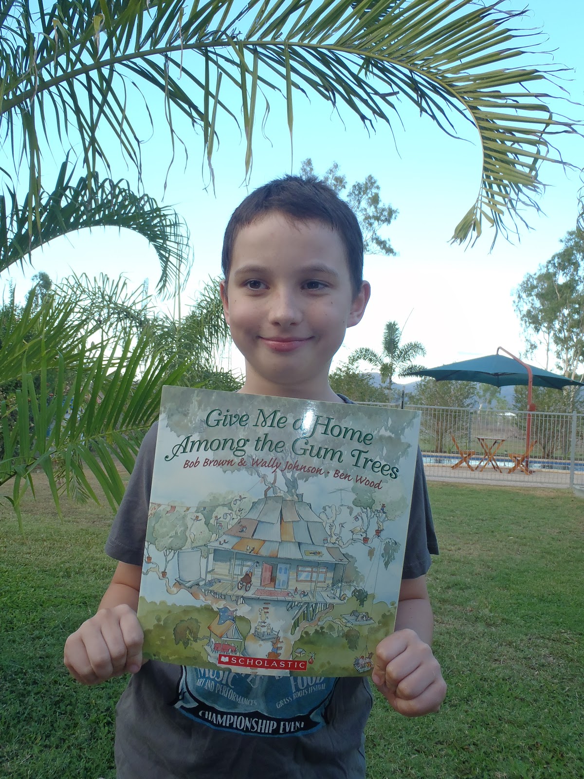 Find me with a book Give Me A Home Among The Gum Trees Reviewed by Tom