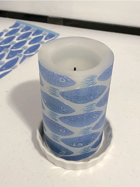 blue fish decorated candle