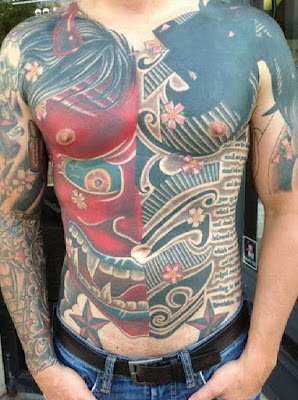 Scary devil writing tattoos giving enchanted expression Nautical star tattoos on the stomach looks beautiful