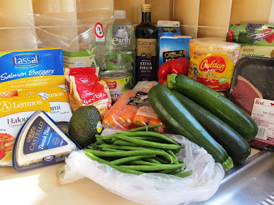 Selection of groceries arranged on a kitchen bench.