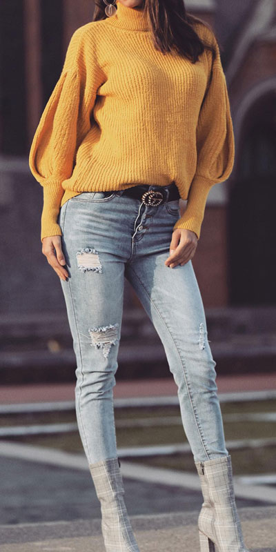 Knitted outfits are versatile pieces that adapt to every woman's style. Mix up your style with these 25 Charming Knitwear to Keep You Stylish and Warm. Winter outfits via higiggle.com | yellow balloon sleeved sweater | #knit #winter #fashion #sweater