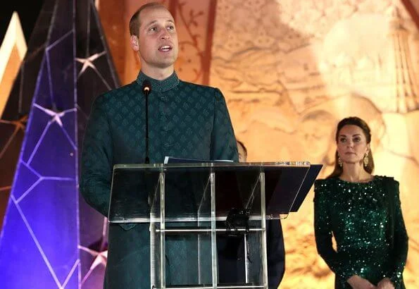 Kate Middleton wore a sparkling emerald green gown by Jenny Packham, and earrings by O'nita. Prince William wore a traditional Sherwani by Naushemian