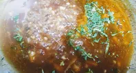Sprinkle Corriander leafs over chicken hot and sour soup recipe