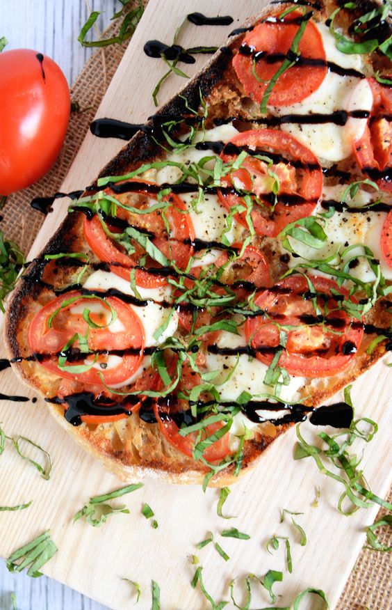 A Caprese Ciabatta Flatbread spiced up with a roasted garlic spread