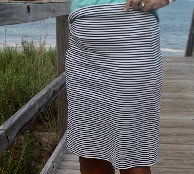 DIY striped knit skirt and v-neck tank top on the beach.