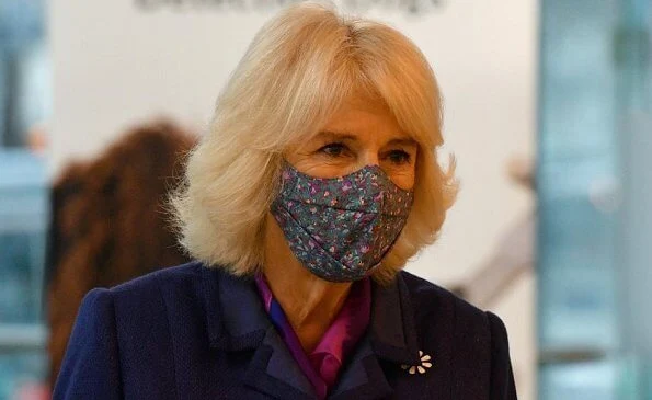 Duchess of Cornwall visited Paddington Station to watch a demonstration by the charity Medical Detection Dogs. blue navy blazer