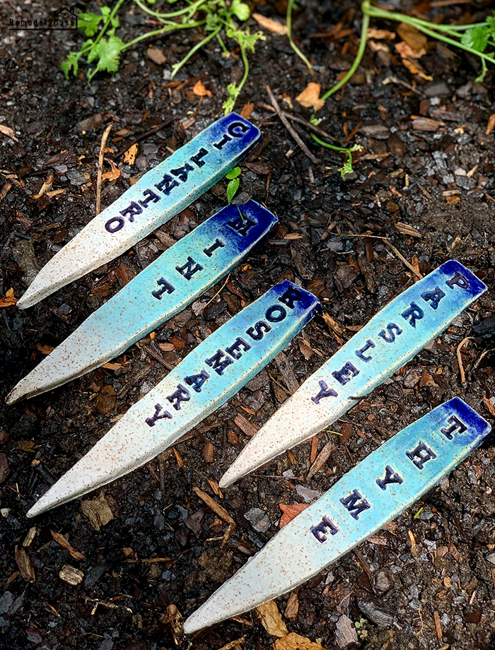 gardening - ceramic herb markers on the soil