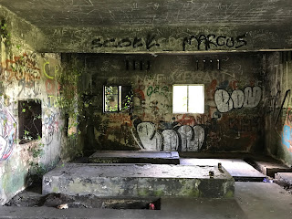Inside view of one of the abandoned WWII buildings on Cramond Island.  It is a concrete shell covered in graffiti.  Photo by Kevin Nosferatu for the Skulferatu Project