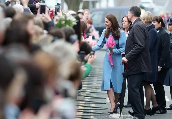 Kate Middleton wore Mulberry blue Ashleigh cape coat and a new Jenny Packham dress.The Duchess is wearing a cape coat by Mulberry