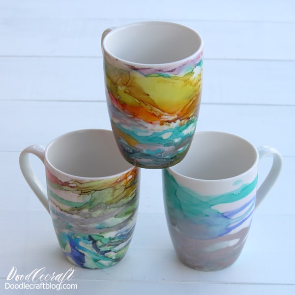 Alcohol ink art on ceramic mugs make the perfect handmade gift! These are perfect for all skill levels from beginner to expert. Alcohol ink is the latest craft trend and you will love it--plus mugs are a gift that keep giving. Make an alcohol ink art piece on a ceramic mug with a full video tutorial. 