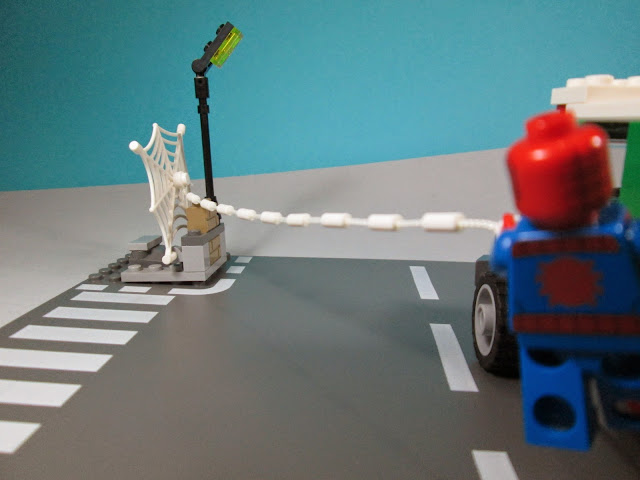 Set LEGO Marvel Super Heroes 76015 - Doc Ock Truck Heist.