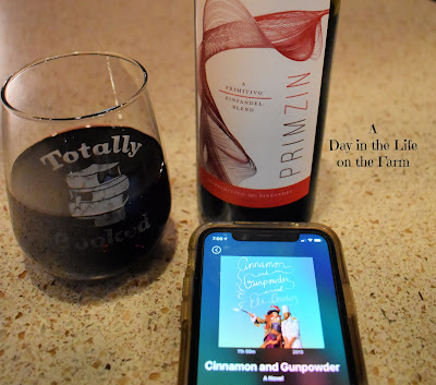 wine and phone with book
