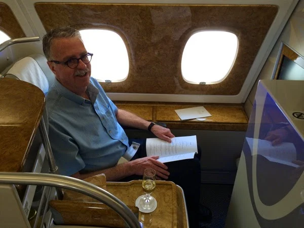 customer John Briggs in Business Class on Emirates A380 aircraft