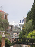 A cruise ship fills the space between the houses copyright Deborah Cater