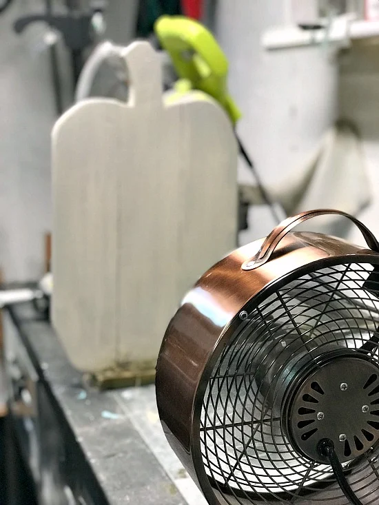 White pallet pumpkin drying by the fan