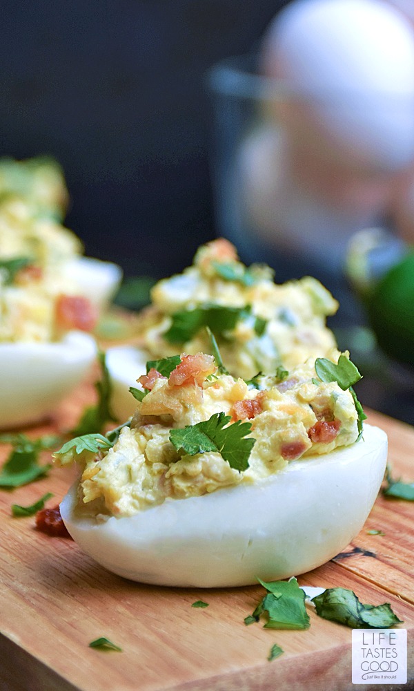 Jalapeno Popper Deviled Eggs | by Life Tastes Good. Can you imagine the goodness?! A deliciously tasty twist on Jalapeno Poppers loaded with cream cheese, fresh jalapeno, cheddar cheese, and BACON all stuffed into an edible dish you can eat with your hands! This might just be the perfect appetizer...