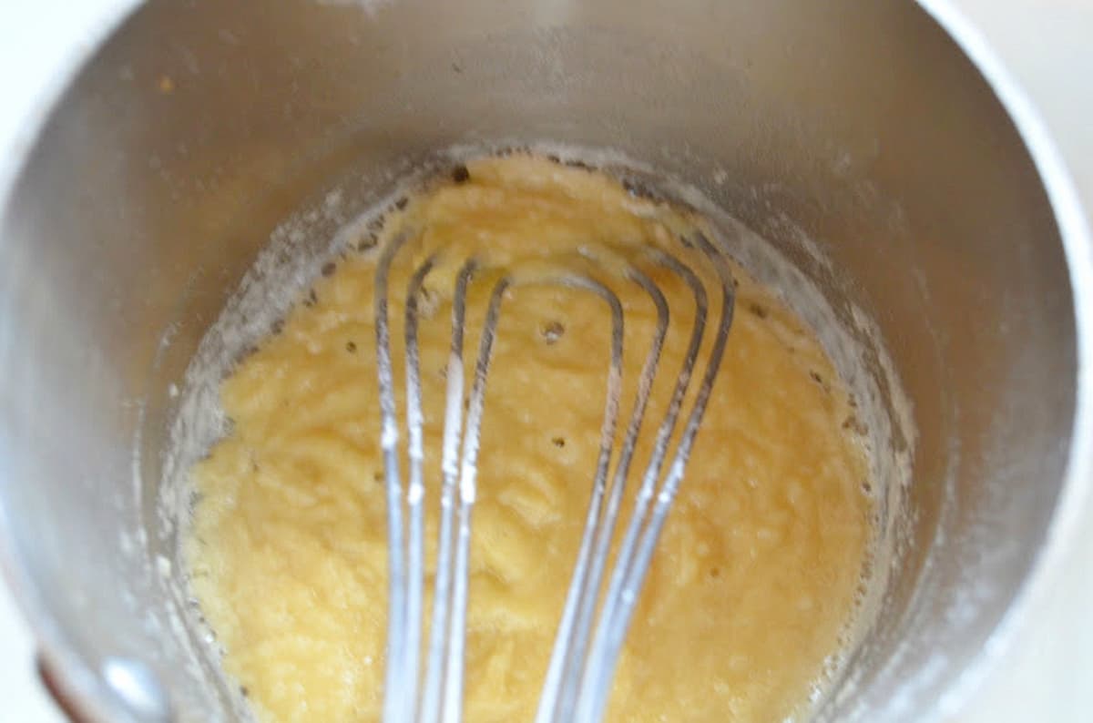 A medium saucepan with flour and butter roux.