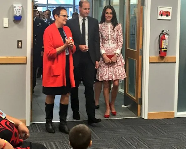 Kate Middleton wore Alexander McQueen red white patterned dress, clutch, shoes, red pumps