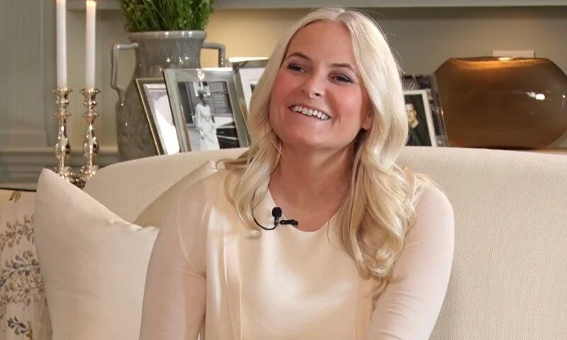 Crown Princess Mette Marit wore an ivory cream virgin wool and silk blend midi dress from Valentino