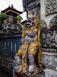 Hindu Balinese Guard Statue In Front Of The Temple Gate At Patemon Village, North Bali, Indonesia
