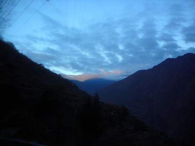 The early rays of the Himalayan sun dancing in the horizon