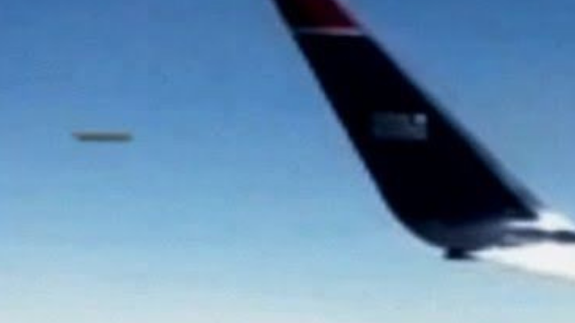 This Cigar shape UFO was filmed so close to the jet plane.