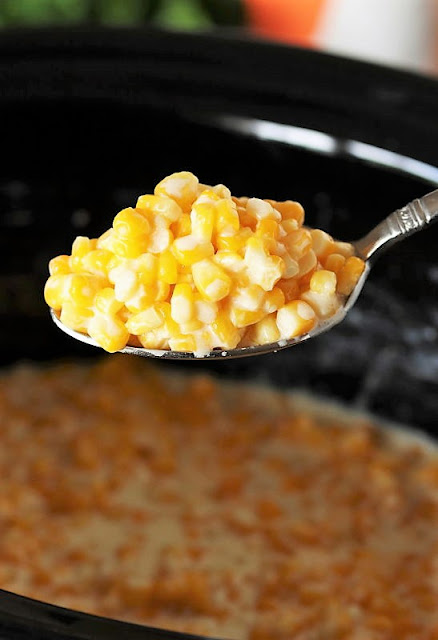 Serving Spoon of Crock Pot Creamed Corn Image