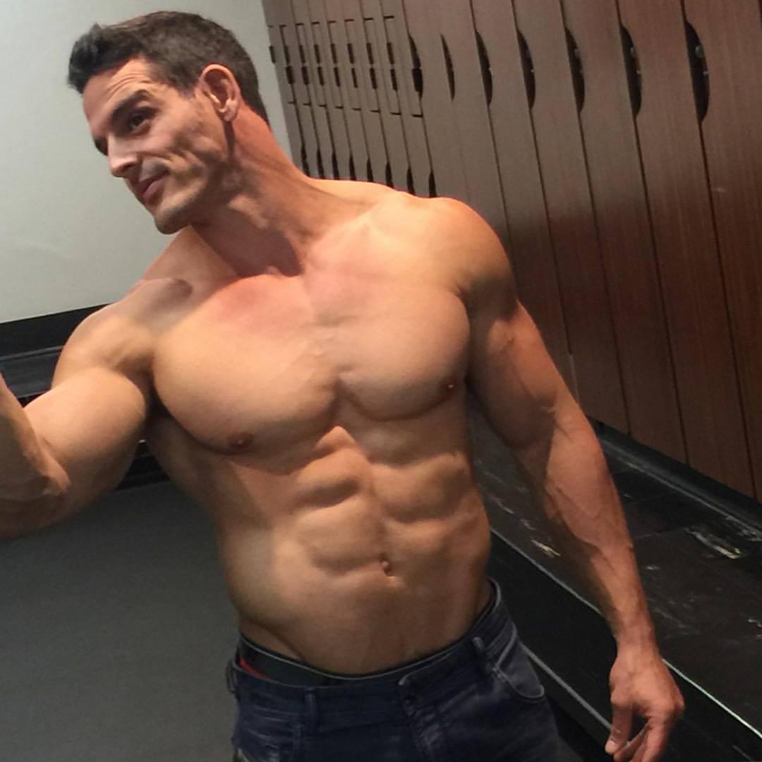 handsome-masculine-shirtless-muscle-man-gym-locker-room-cocky-dilf-pecs-selfie