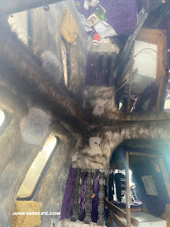 Mirrored ceiling and purple shag carpet throughout.